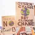 Group of demonstrators on road, young people from different culture and race fight for climate change - Global warming and enviroment concept - Focus on banners