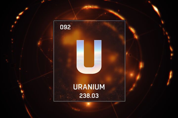 3D illustration of Uranium as Element 92 of the Periodic Table. Orange illuminated atom design background with orbiting electrons. Design shows name, atomic weight and element number