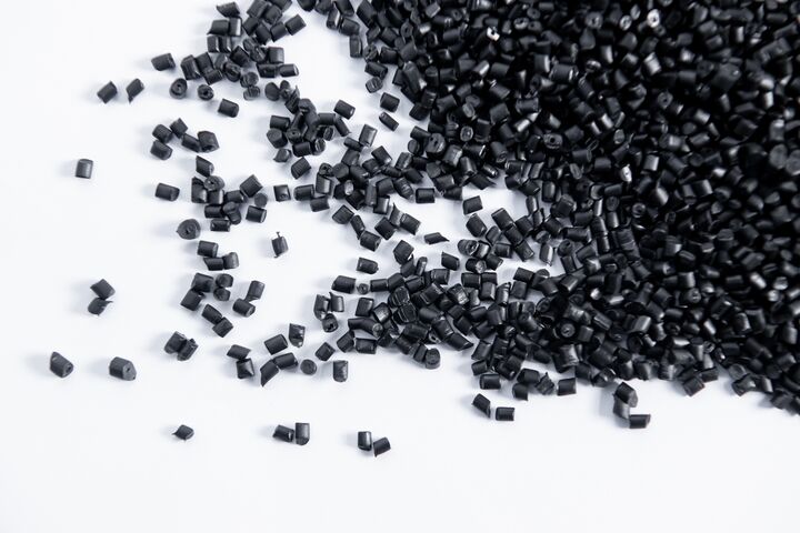 Polypropylene granule close-up background texture. plastic resin ( Masterbatch).Grey chemical granules for industrial plastic production