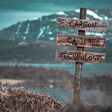 carbon capture technology text quote engraved on wooden signpost outdoors in landscape looking polluted and apocalyptic.