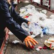 At modern recycling plant. Separate garbage collection. Workers sorting trash to be processed. Trash sorting. Background