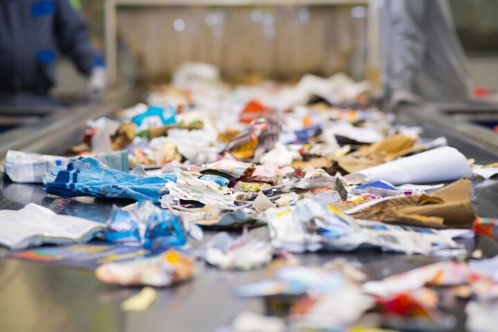 view of waste paper on a conveyor belt