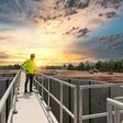 Civil Engineer inspects the construction of a large sewage-water treatment pipe unfinished
