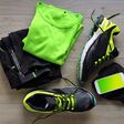 Clothes make running with isotonic drink, phone and T-shirt