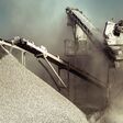 Industrial background with working gravel crusher