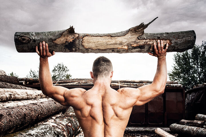 Strong muscular man holding heavy wood trunks, man, wood, log, high, place, abandoned, grungy, young, healthy life, gym