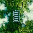 Concept depicting new possibilities for the development of ecological battery technologies and green energy storage in the form of a battery-shaped pond located in a lush forest. 3d rendering.