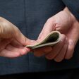 Concept - corruption. Giving a bribe. Money in hand