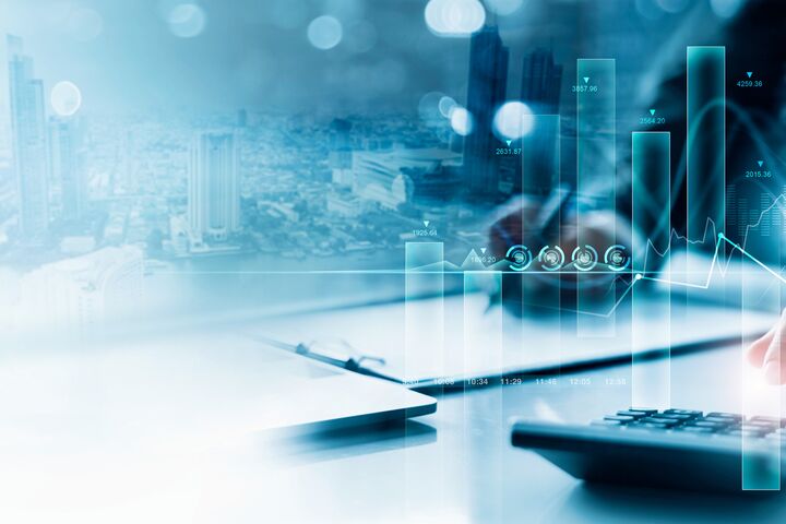 Businessman working with using a calculator to calculate the numbers of financial and analyzing sales data on economic growth graph chart, Banking and finance, Digital marketing and business strategy.