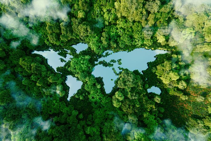 A lake in the shape of the world's continents in the middle of untouched nature. A metaphor for ecological travel, conservation, climate change, global warming and the fragility of nature.3d rendering