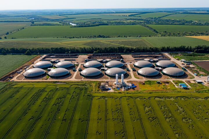 Production of sustainable fuel called bio gas. New factory in field. View from above. Ecological production concept