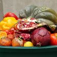 Food Waste in Grocery Store Retail. Discarded unsold damaged fruits and vegetables in packages. Food produced is wasted.