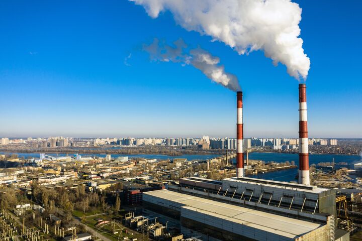 Garbage incineration plant. Waste incinerator plant with smoking smokestack. The problem of environmental pollution by factories aerial view.