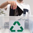 Man throwing away broken mobile phones in recycle container. Hazardous E-Waste Recycling. Waste Electrical and Electronic Equipment.