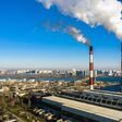 Garbage incineration plant. Waste incinerator plant with smoking smokestack. The problem of environmental pollution by factories aerial view.