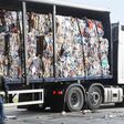 Stacks of recycled paper in lorry at recycling plant