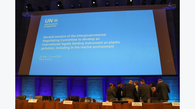 INC Second Seccion, Paris: Delegates huddle on the podium as discussions on the rules of procedure continue
