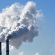 industrial smoke from chimney on blue sky