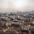 Discarded Electronics In Landfill With Toxic Smoke