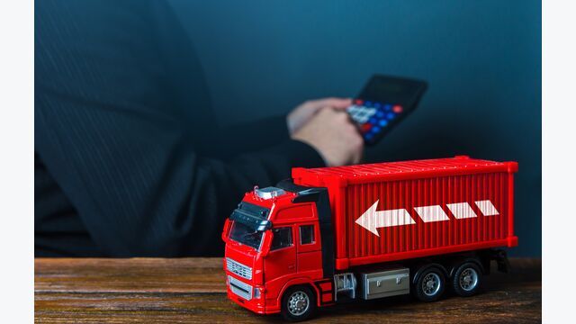 Businessman calculates the cost of shipping. Optimization of delivery costs, routing algorithm. Rising prices, global containers shortage crisis. Transportation inflation, shipping rates.