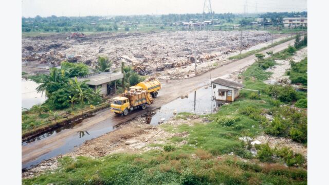 Figure 4. On Nooch dumpsite entrance in Bangkok, 1983. Note high water table.