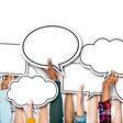 Group of Hands Holding Speech Bubbles