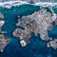 Concept environmental with plastic pollution ocean and human waste. Continents earth are made up of garbage, surrounded by water.