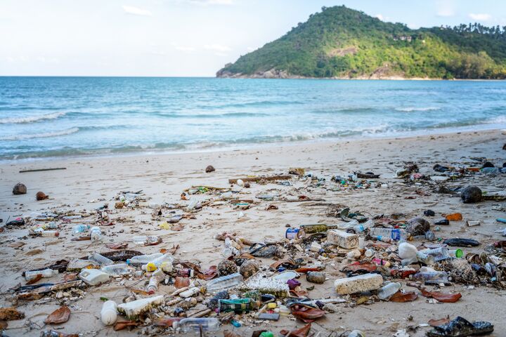 Garbage on beach, environmental pollution Koh Phangan island Thailand. Tropical beach pollution.