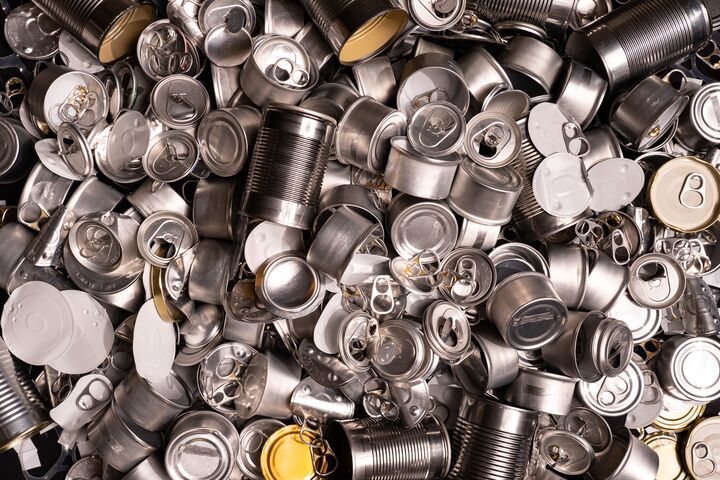 Large amount of metal tins, cans and jars for recycling. Aluminum metal food and drink sorted scraps. Steel packaging. Zero waste and recycle of domestic waste at home concept. No pollution.