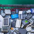 Belgrade, Serbia - October 17, 2021: Big Bunch of Old Mobile Phone Cellphone Lithium Batteries for Recycling Disposal.