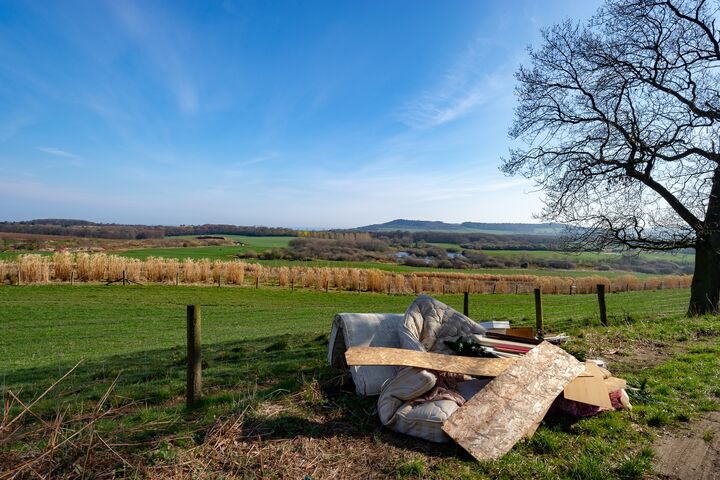 Fly Tipping Christmas Tree, Double Mattress, Timber, Furniture, Carpets and General Household Waste in a Beautiful Scenic Rural Area over looking Farms and