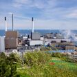 People in public space on the roof of Amager Bakke known as Amager Slope or Copenhill, combined heat and power waste to energy plant with recreational facility - dry ski run, hiking trail and climbing wall on May 1, 2023 in Copenhagen, Denmark.