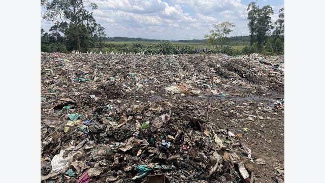 Figure 1: Sieving residuals dumped next to the composting plant in Mukono, Uganda; picture taken in September 2023 (photo credit: Sara Neuburg)