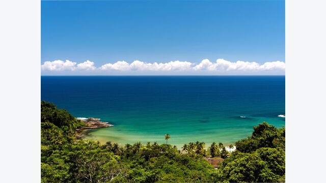 This photograph of the breathtaking Engenhoca beach, was taken using a Olympus digital camera. This is a paradisiac beach surrounded by palm trees and tropical rainforest. This beach is located within a private property so it can only be accessed by foot through a beautiful trail and therefore this beach does not tend to get too crowded. It is very well known amongst the surfing community for its good waves, especially for longboard.