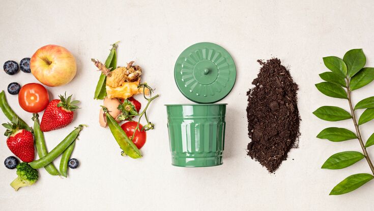Green compost bin and kitchen leftovers. Recycling scarps, sustainable and zero waste lifestyle concept. Fruits and vegetable garbage waste turning into organic fertilizerd soil. Top view, flatlay