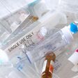 medical syringes and ampoules of plastic and glass that were in use, waste, close-up