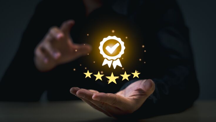 Business Quality Achievement and Excellence Concept. Businessman showcases a glowing five-star rating and award badge, symbolizing high quality and excellence in business.