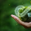 businessman holding circular economy icon Circular economy concept for future business growth and environmental sustainability and reduce pollution for future business and environmental growth.