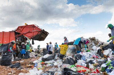 UBOLRATTHANI THAILAND- JAN 10: People collect gabage from Removal and landfill waste from industry and households in rural grasslands. January 10, 2017 in Ubolrat thani province,Thailand